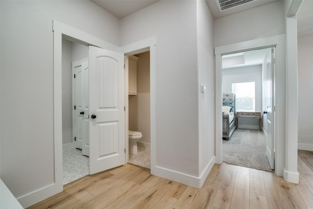 corridor featuring light hardwood / wood-style floors