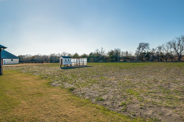 view of yard with a rural view