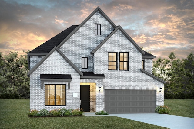 view of front facade with a lawn and a garage