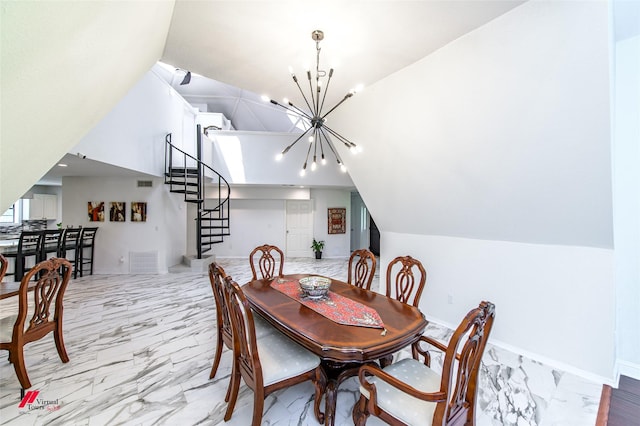 dining space with vaulted ceiling and a chandelier