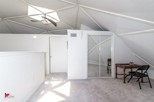 additional living space featuring ceiling fan, vaulted ceiling, and carpet