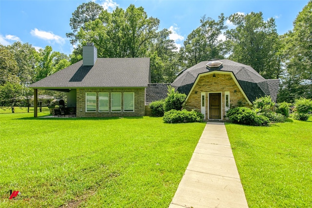 view of front of home with a front yard