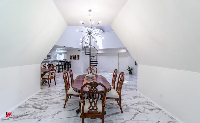 dining room featuring an inviting chandelier and lofted ceiling