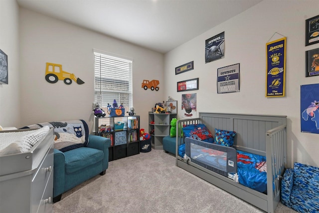 bedroom featuring light carpet