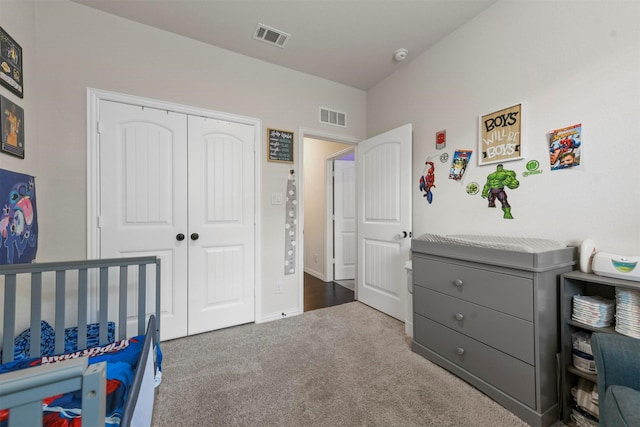 carpeted bedroom with a closet