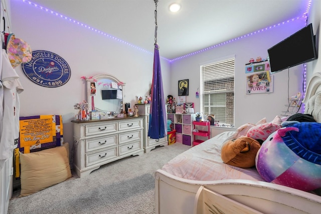 bedroom featuring light colored carpet