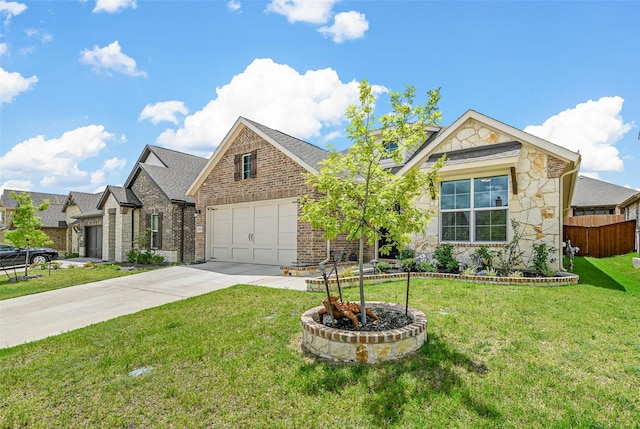 view of front of house with a front yard and a garage