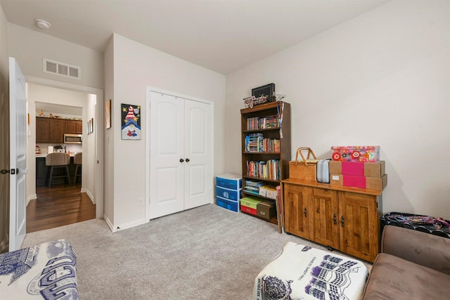 interior space featuring light carpet