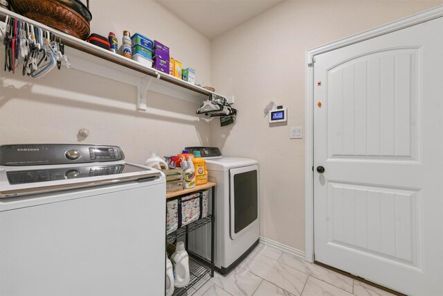 washroom with washer and clothes dryer