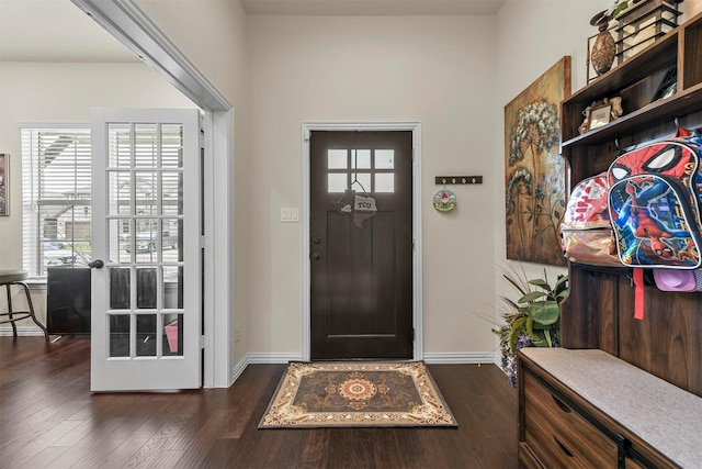 mudroom with dark hardwood / wood-style flooring and french doors