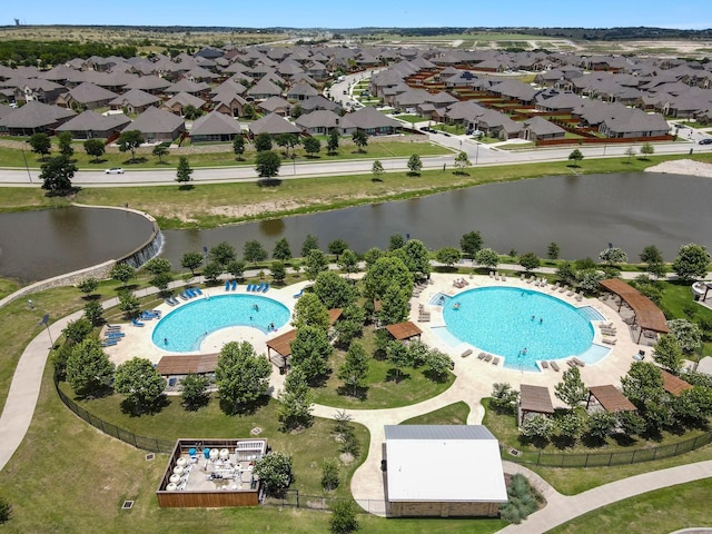 birds eye view of property with a water view