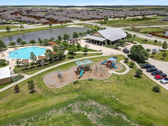 birds eye view of property with a water view