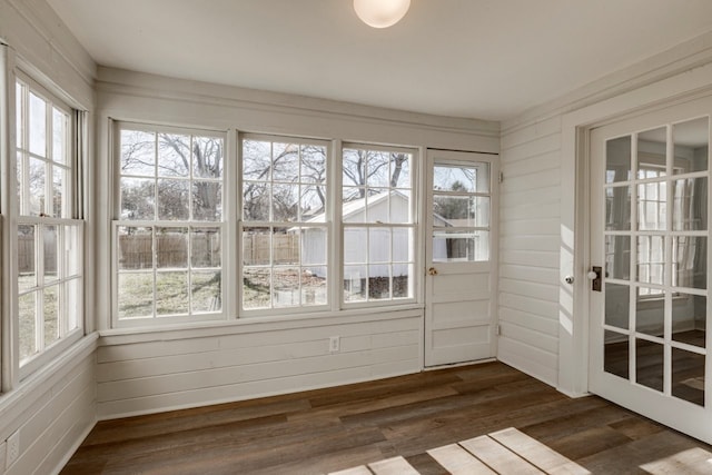 unfurnished sunroom with plenty of natural light