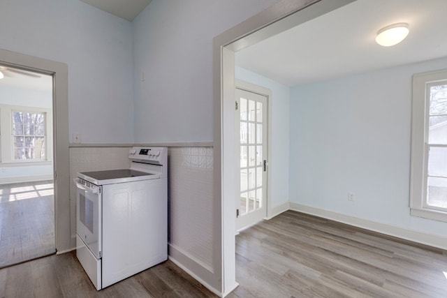 washroom with tile walls and light wood-type flooring