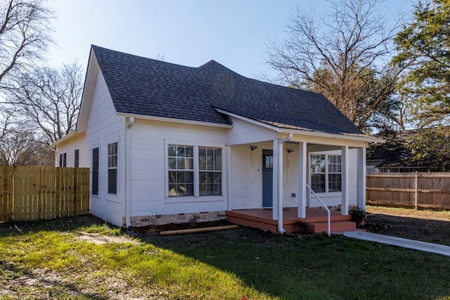 bungalow with a front yard