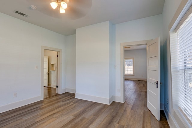 unfurnished room featuring ceiling fan and wood-type flooring