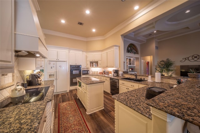 kitchen with a center island, kitchen peninsula, crown molding, black appliances, and custom range hood