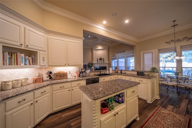 kitchen featuring kitchen peninsula, a kitchen island, dark wood-type flooring, and light stone counters