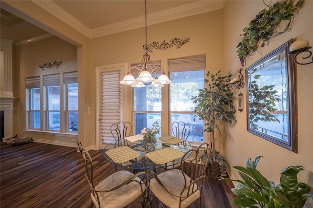 dining room with a chandelier, hardwood / wood-style floors, and ornamental molding