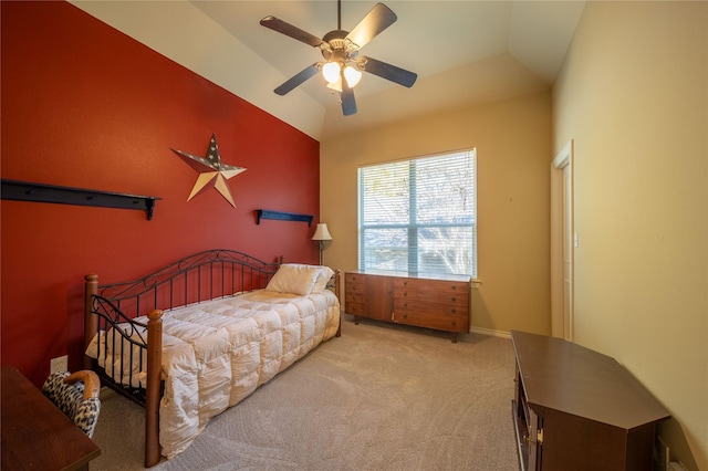 bedroom with ceiling fan, light colored carpet, and vaulted ceiling