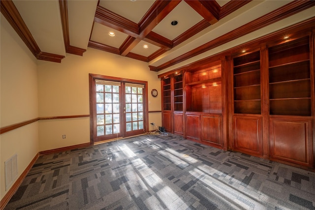 empty room featuring french doors, coffered ceiling, beamed ceiling, dark carpet, and ornamental molding