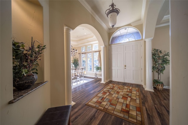 foyer entrance featuring dark hardwood / wood-style floors and ornamental molding