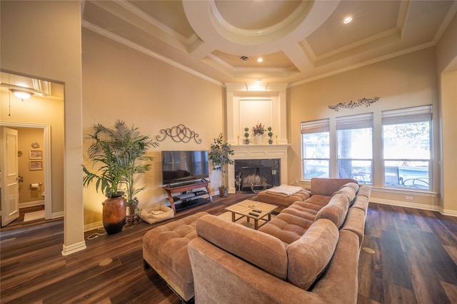 living room with a fireplace, dark hardwood / wood-style flooring, coffered ceiling, and ornamental molding