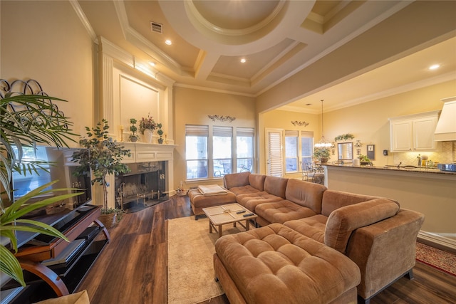 living room featuring ornamental molding, coffered ceiling, dark wood-type flooring, a premium fireplace, and beamed ceiling