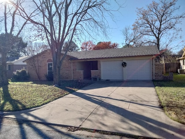 ranch-style home with a garage