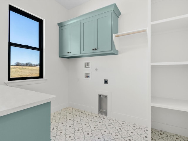 laundry room featuring electric dryer hookup, cabinets, gas dryer hookup, and hookup for a washing machine