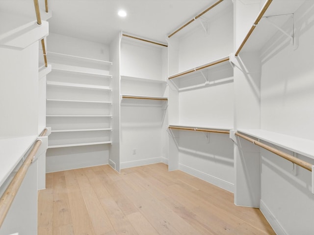 spacious closet featuring light wood-type flooring