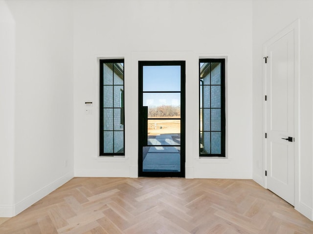 doorway featuring light parquet flooring