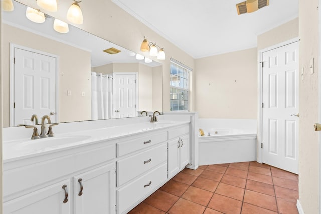 bathroom featuring tile patterned floors, a bathtub, crown molding, and vanity