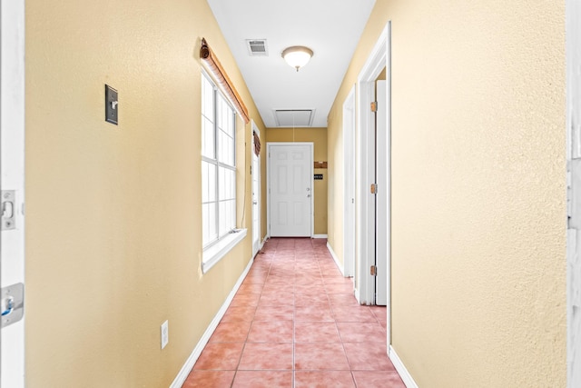 corridor featuring light tile patterned flooring