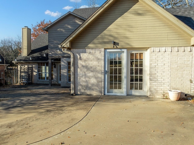 rear view of property featuring a patio