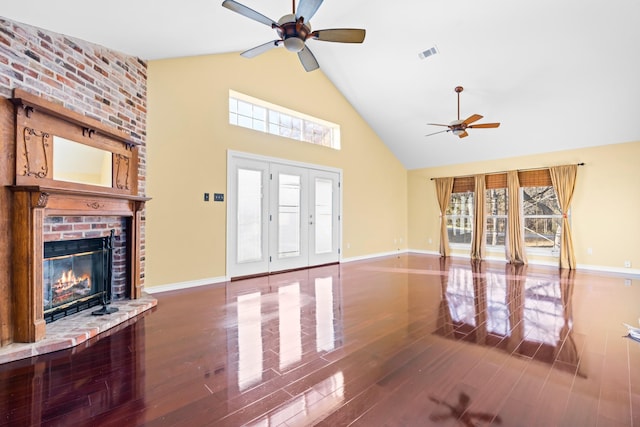 unfurnished living room with ceiling fan, a fireplace, high vaulted ceiling, and hardwood / wood-style flooring