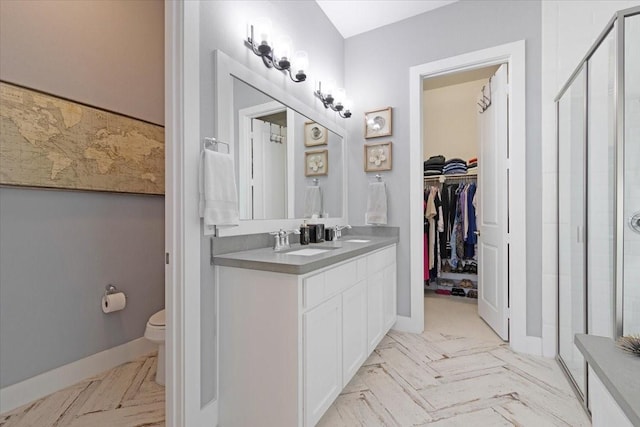 bathroom with toilet and vanity