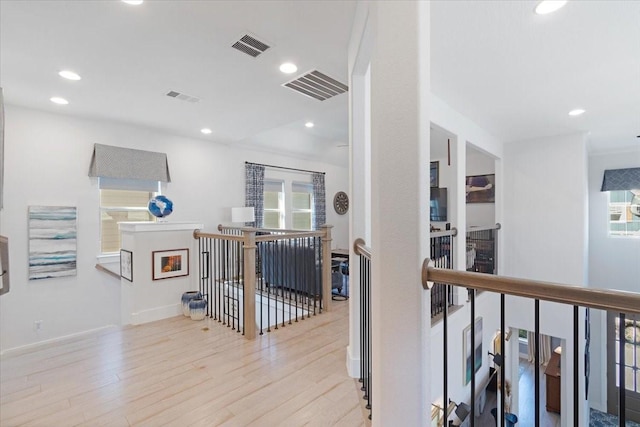 hallway with light hardwood / wood-style flooring