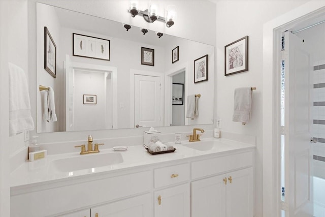 bathroom with walk in shower and vanity