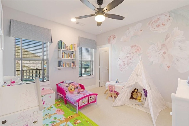 carpeted bedroom featuring ceiling fan