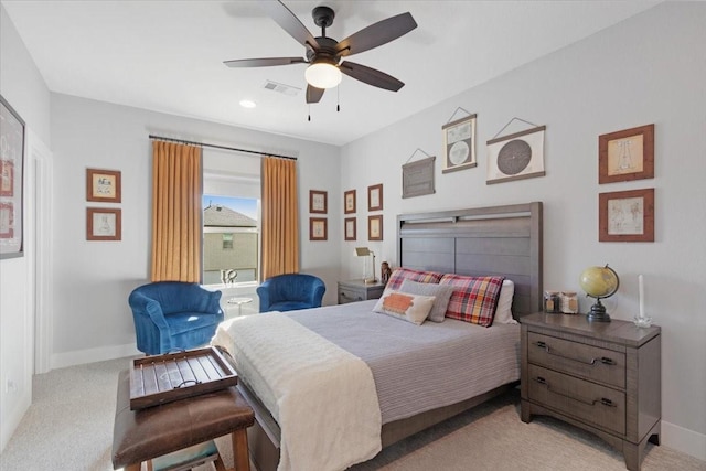 bedroom with ceiling fan and light colored carpet