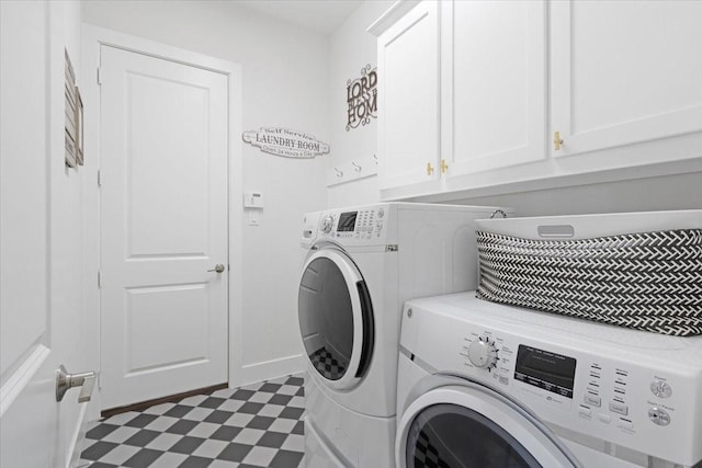 laundry area featuring cabinets and separate washer and dryer