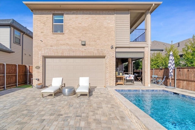 view of swimming pool with a patio area