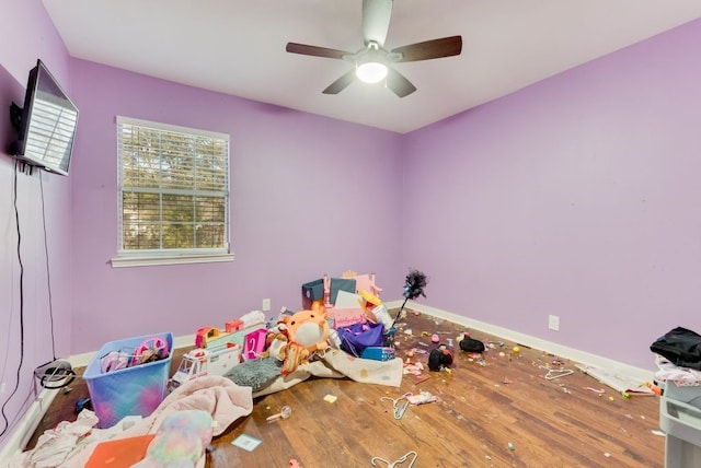 playroom featuring hardwood / wood-style flooring and ceiling fan