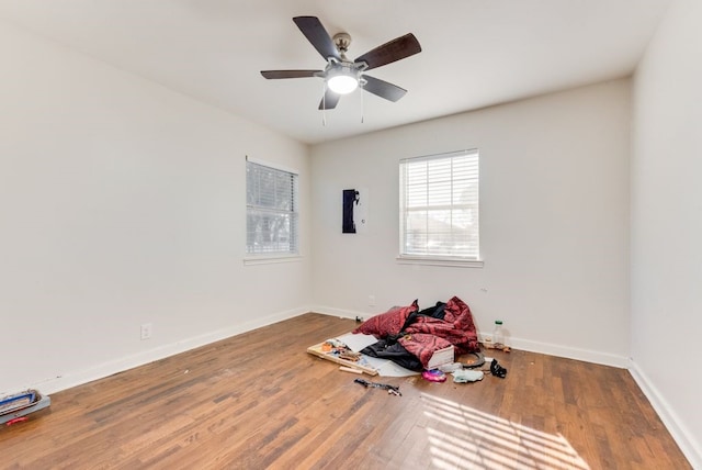 unfurnished room with ceiling fan and wood-type flooring