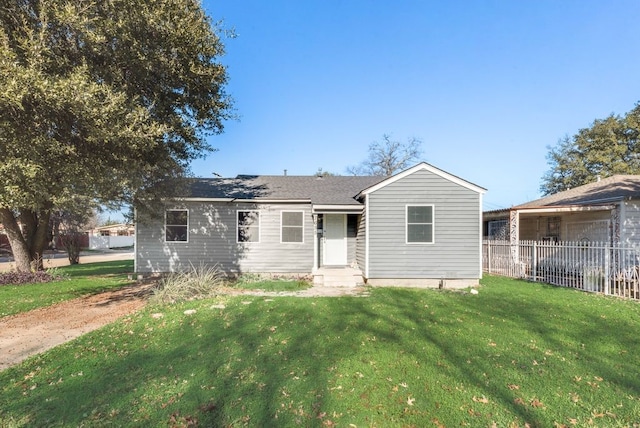 ranch-style home with a front yard