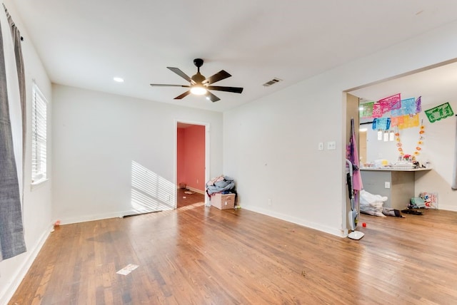 spare room featuring ceiling fan and light hardwood / wood-style floors