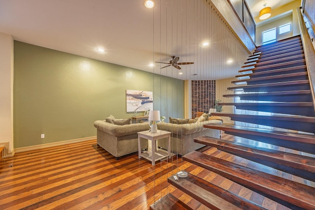 living room with ceiling fan and hardwood / wood-style floors