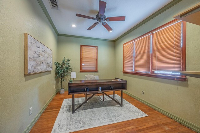 office area with ceiling fan, light hardwood / wood-style floors, and ornamental molding