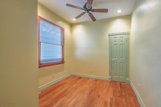 empty room featuring light hardwood / wood-style flooring and ceiling fan